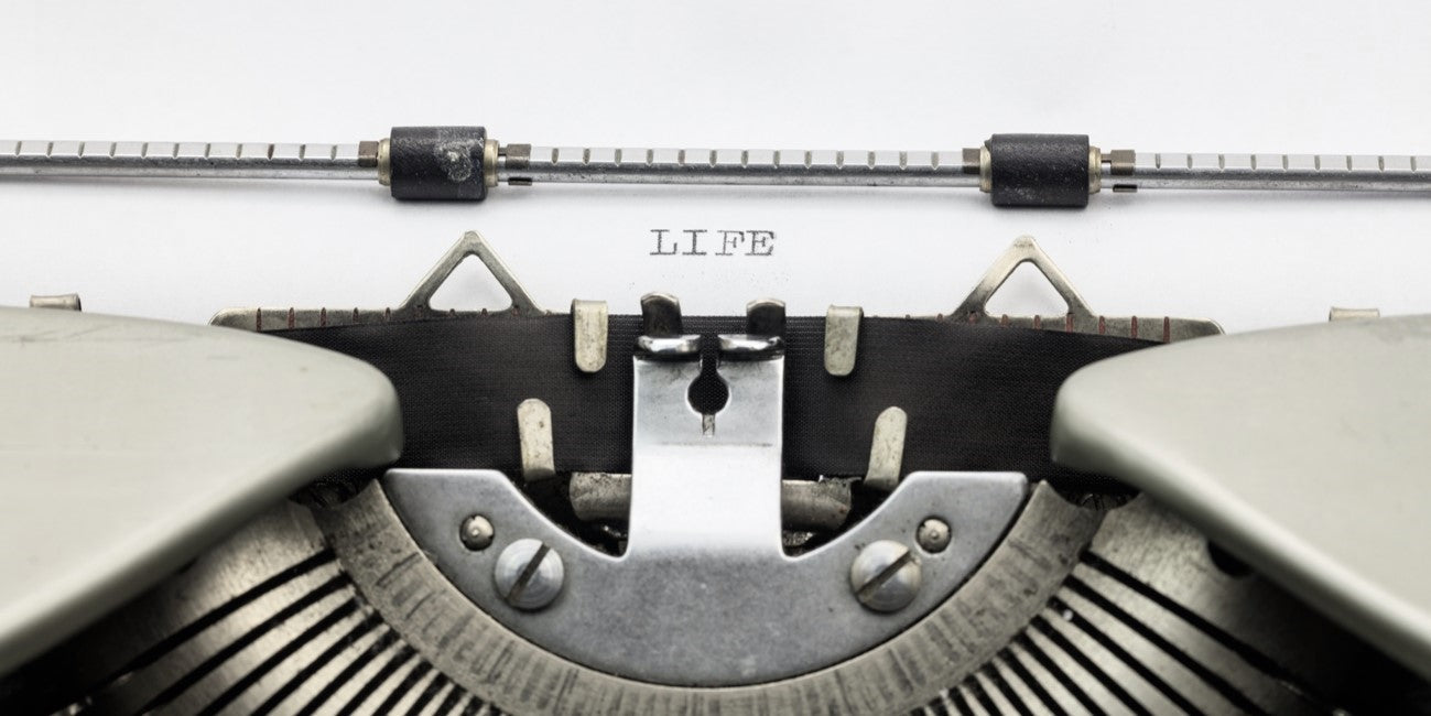 Typewriter typing the word "LIFE"