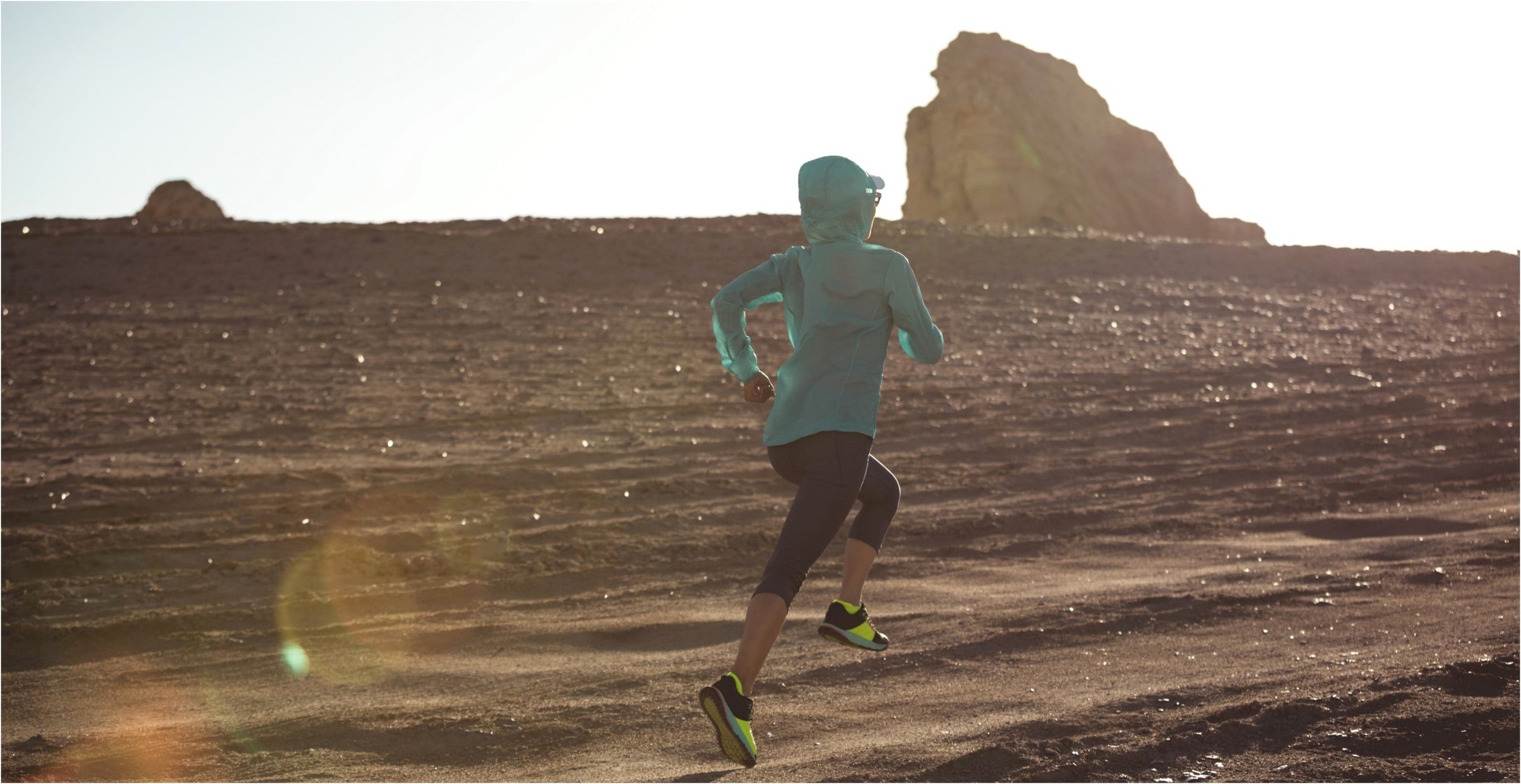 A woman jogging through the desert